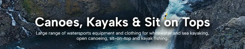 Man kayaking down a waterfall.